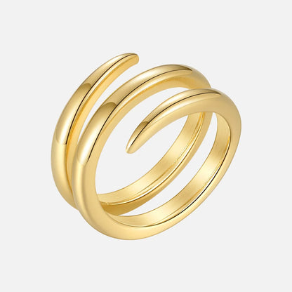 dubbel spiralring i rostfritt stål guld minimalistisk ring mot vit bakgrund