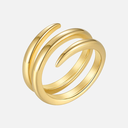 dubbel spiralring i rostfritt stål guld minimalistisk ring mot vit bakgrund